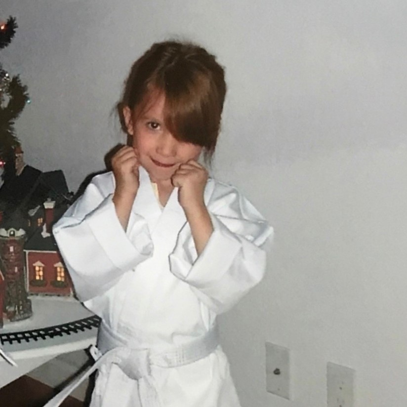 Annie as a child, in her Tai Kwon Do uniform.